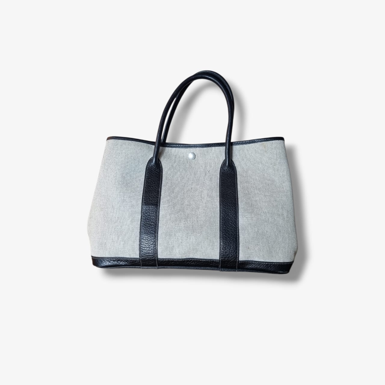 Sac Hermès Garden Party en toile beige et cuir noir seconde main