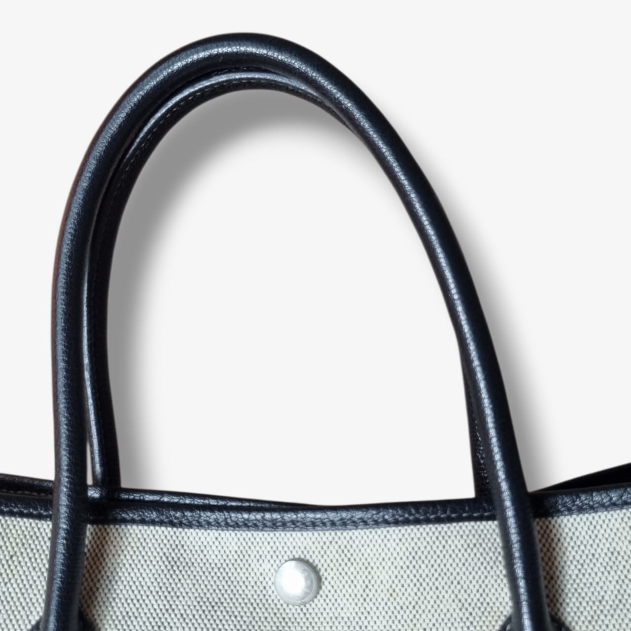 Sac Hermès Garden Party en toile beige et cuir noir seconde main