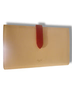Portefeuille CELINE Large Flap cuir grainé beige avec fermeture rouge
