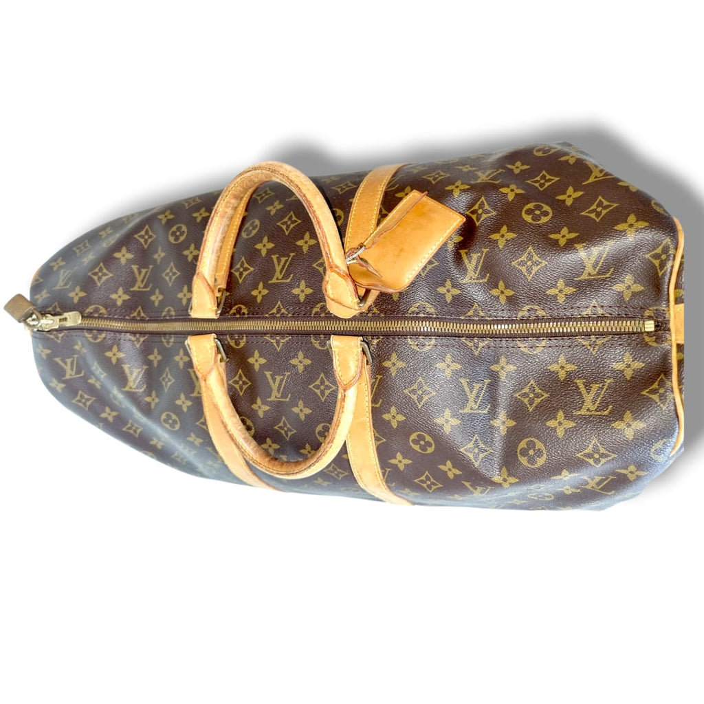 Louis Vuitton Keepall 55 Bandoulière Monogram cadenas clés